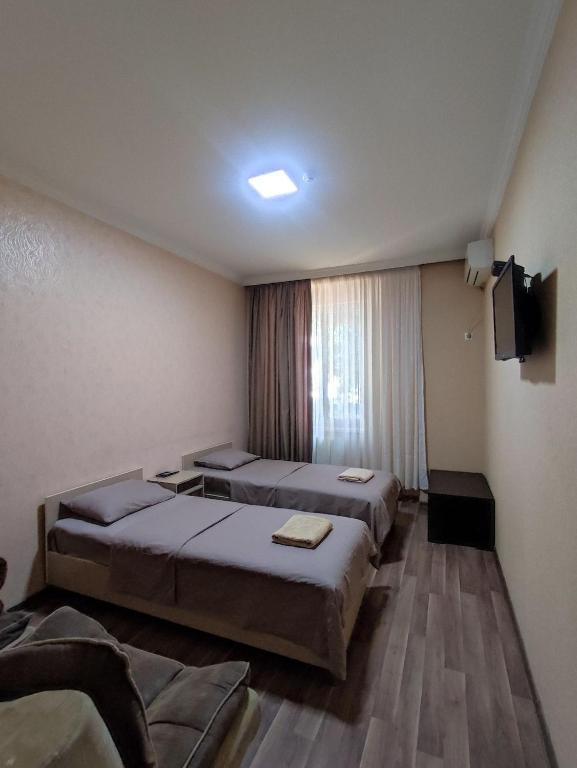 Postel nebo postele na pokoji v ubytování Hotel VENUS