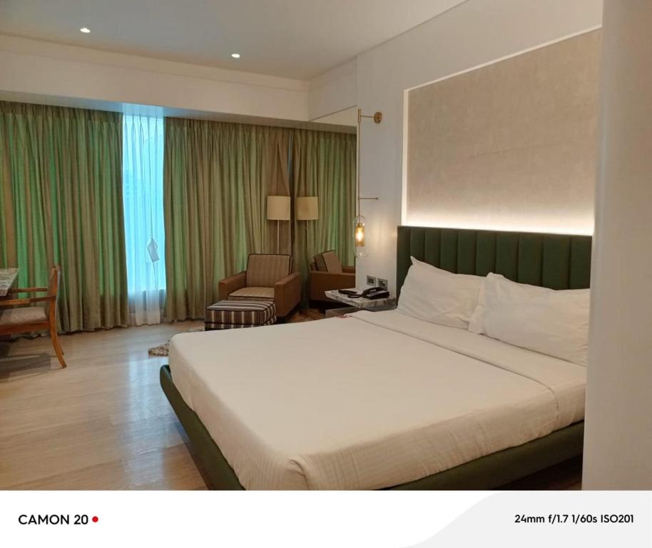 Postel nebo postele na pokoji v ubytování Mirage Hotel, Mumbai International Airport