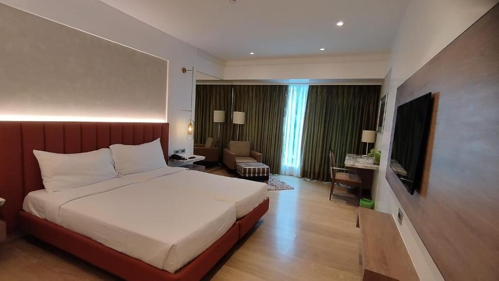 Postel nebo postele na pokoji v ubytování Mirage Hotel, Mumbai International Airport