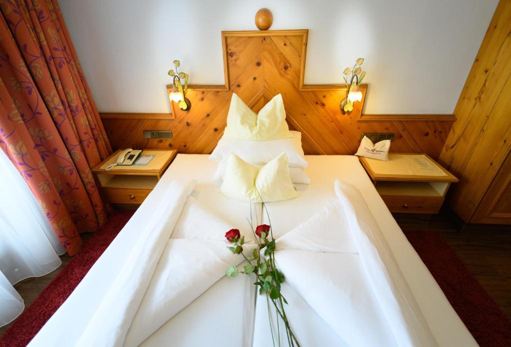 Postel nebo postele na pokoji v ubytování Alpenpark Resort Superior