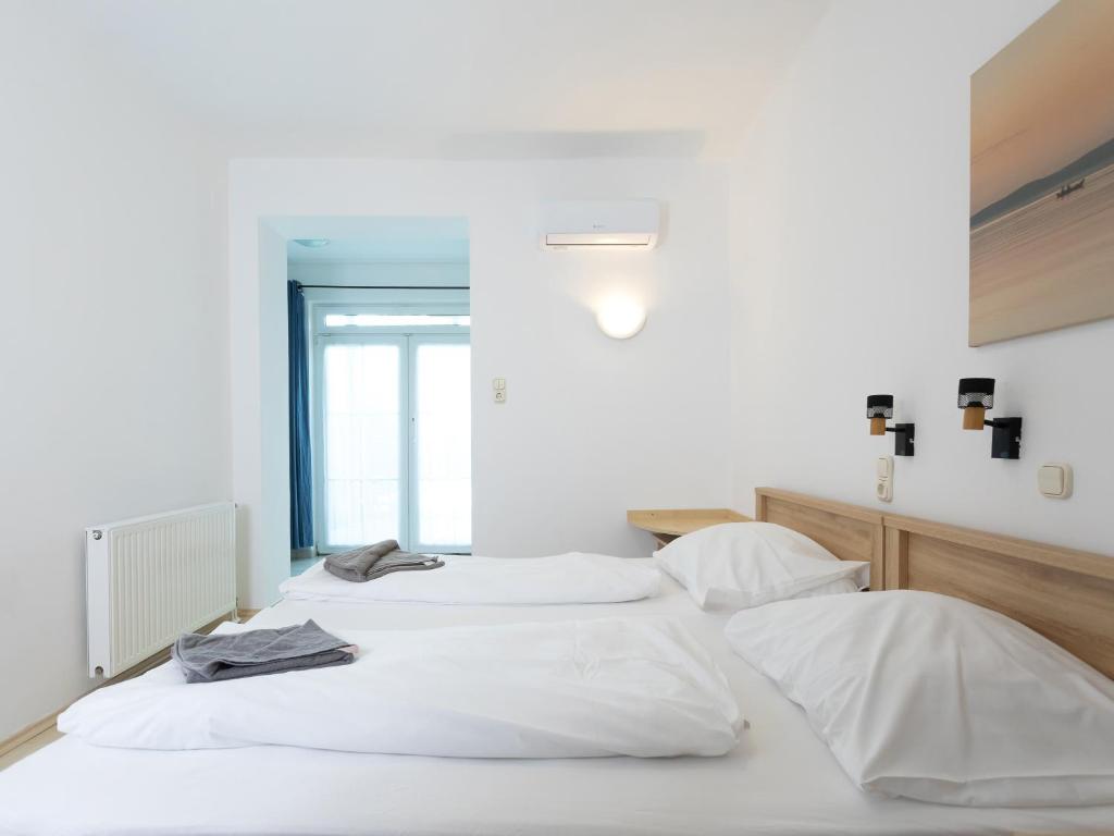 Postel nebo postele na pokoji v ubytování Hotel Platán