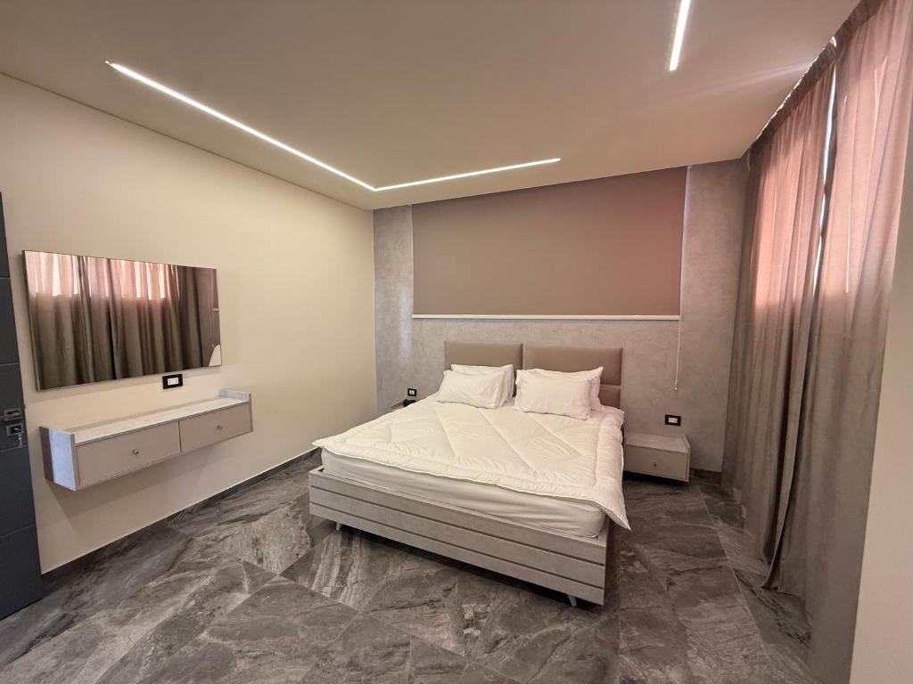 Postel nebo postele na pokoji v ubytování Aquarius Touristic Resort