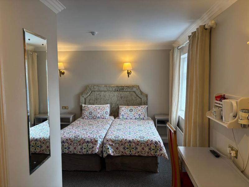 Letto o letti in una camera di Harmony Inn - Glena House