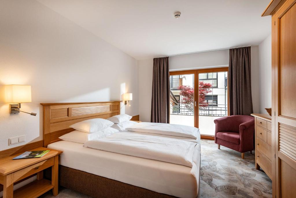 A bed or beds in a room at Alpenvital Tirol Appartements