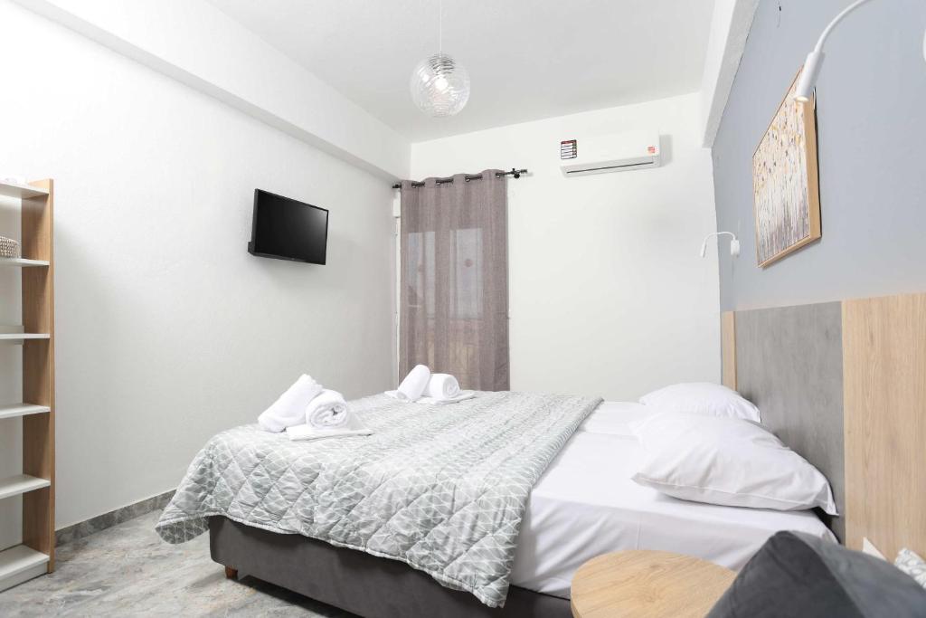 Voodi või voodid majutusasutuse Hotel Adonis toas