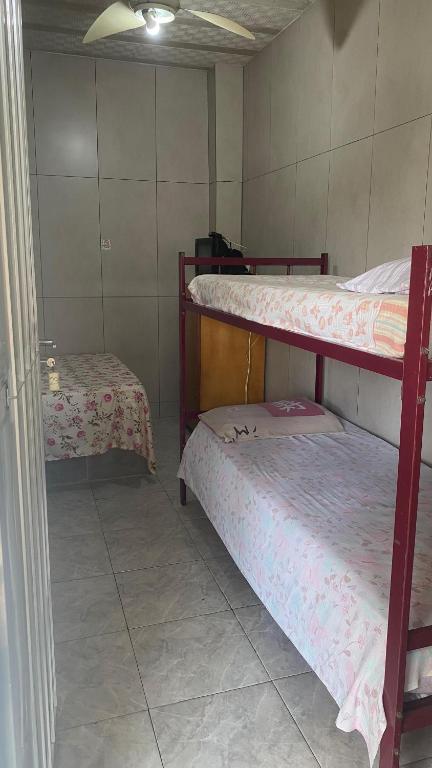 Postel nebo postele na pokoji v ubytování Pousada e Alojamento Engenho de Itaguaí