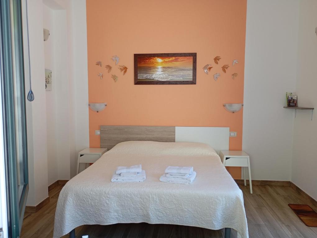 A bed or beds in a room at B&B da AnnaMaria