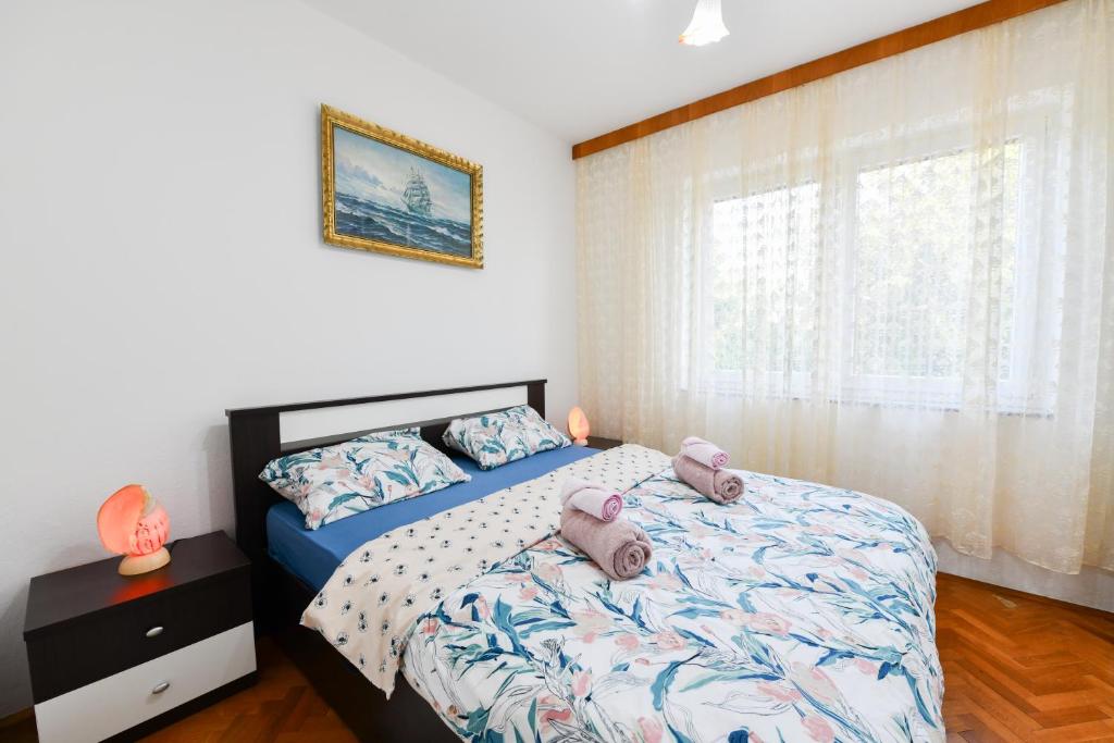Postel nebo postele na pokoji v ubytování Apartman PIK