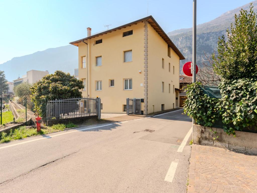an empty street in front of a building at Apartment Calicantus - Nespolo by Interhome in Dro