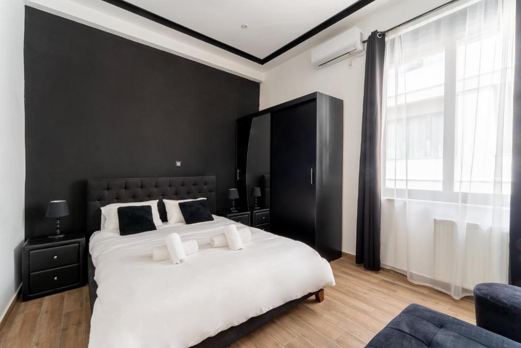 Posteľ alebo postele v izbe v ubytovaní Neo Luxury Suite