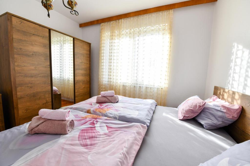 Postel nebo postele na pokoji v ubytování Apartman PIK