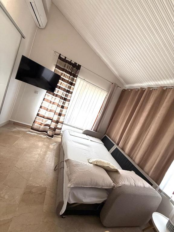 Postel nebo postele na pokoji v ubytování Apartments Olga 2