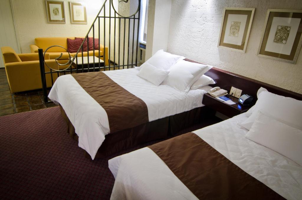 Postel nebo postele na pokoji v ubytování NEhotel Nueva Estancia