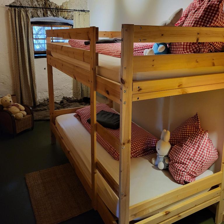 Postel nebo postele na pokoji v ubytování Sachserhof Ferienwohnungen in Sachsenburg