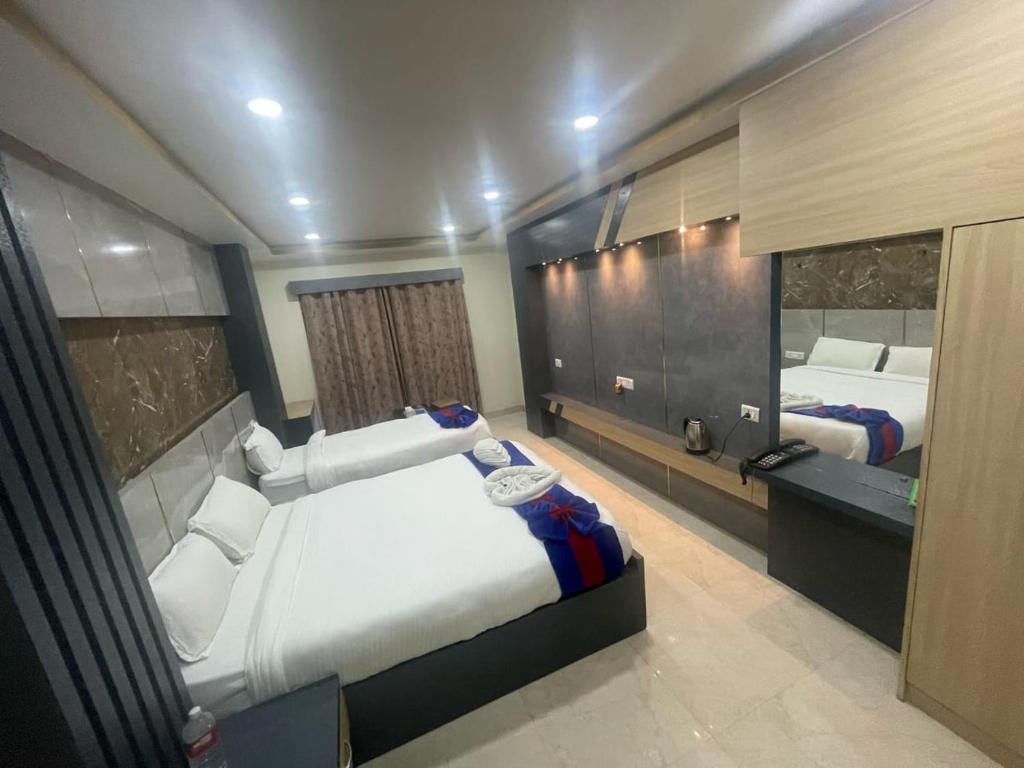 Postel nebo postele na pokoji v ubytování Hotel Ruskin PvtLtd