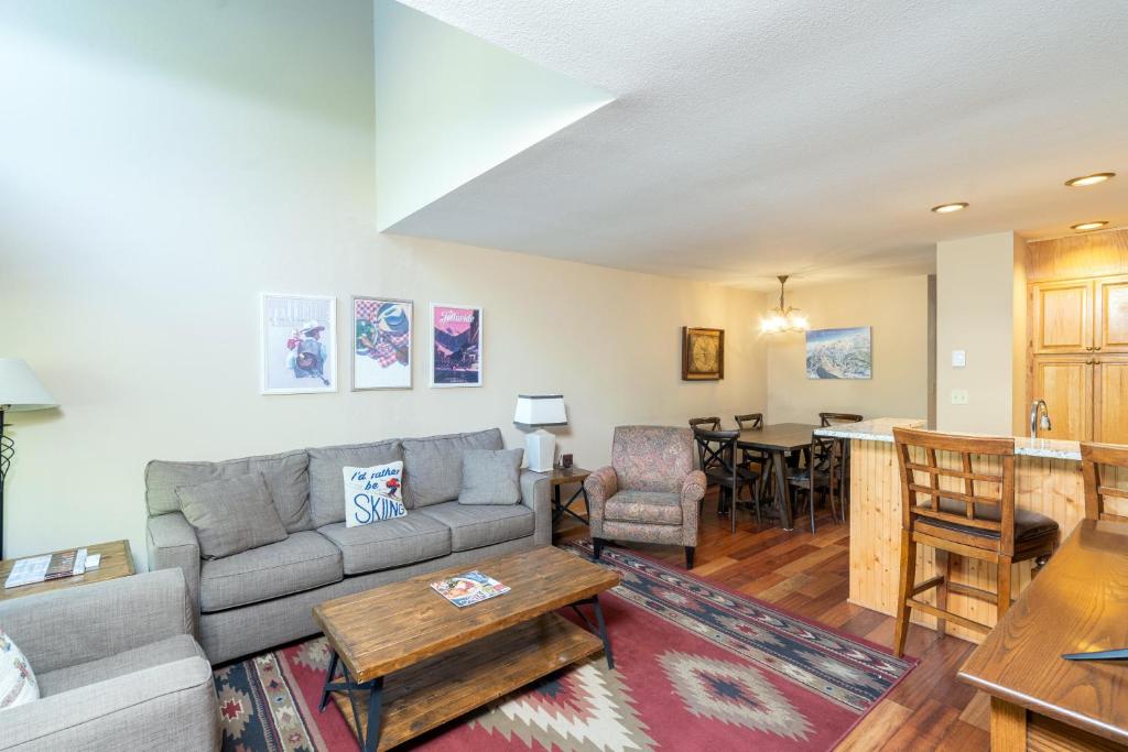 a living room with a couch and a table at Cimarron Lodge 35 condo in Telluride