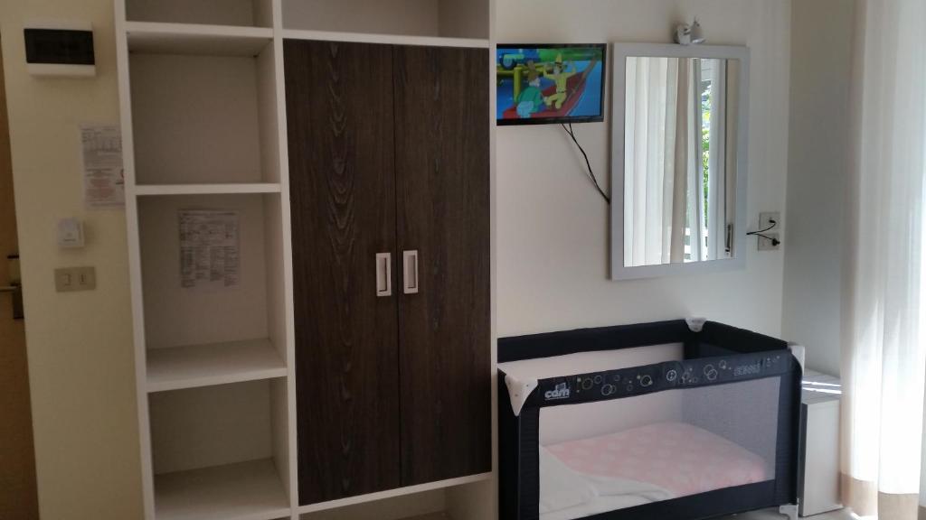 TV a/nebo společenská místnost v ubytování Hotel Tosi