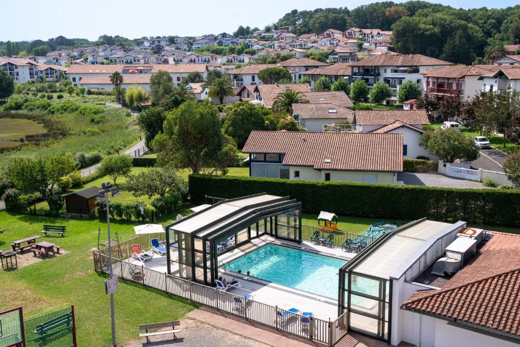 an aerial view of a house with a swimming pool at VVF Urrugne Saint-Jean-de-Luz Côte Basque in Urrugne