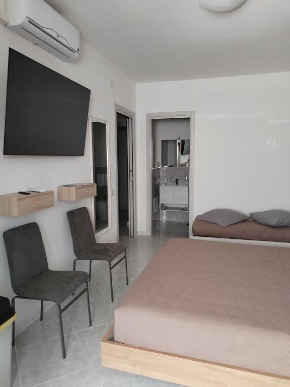 Postel nebo postele na pokoji v ubytování RIU b&b ALGHERO