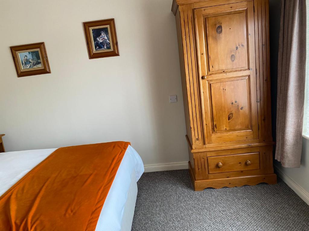 Postel nebo postele na pokoji v ubytování Ros Villa Guesthouse