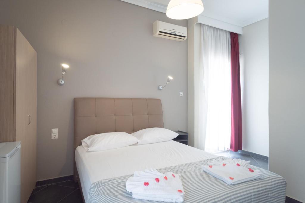 Postel nebo postele na pokoji v ubytování Hotel Mironi and Victoria