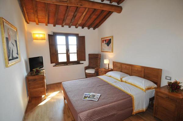 Postel nebo postele na pokoji v ubytování Residence Prunali