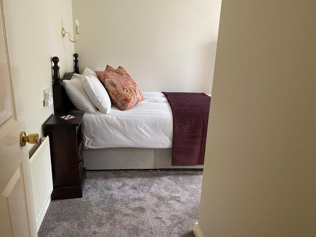 Postel nebo postele na pokoji v ubytování Ros Villa Guesthouse