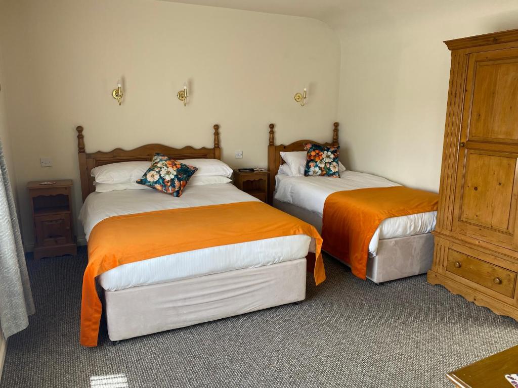 Postel nebo postele na pokoji v ubytování Ros Villa Guesthouse