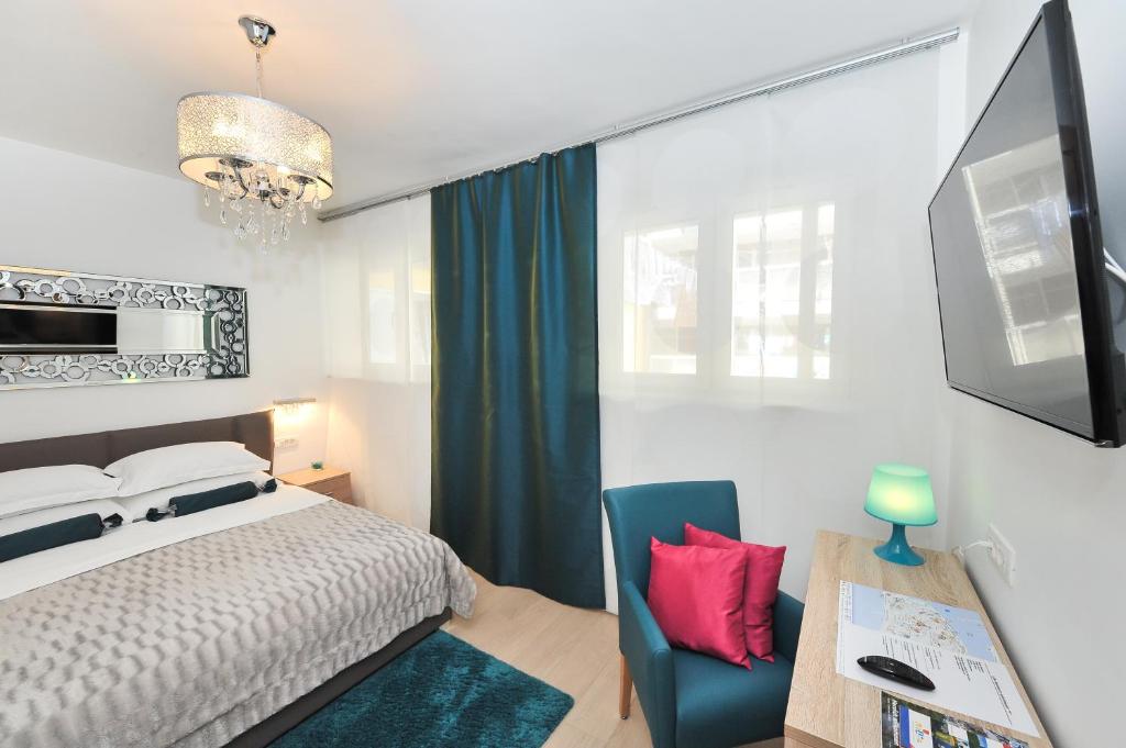 Posteľ alebo postele v izbe v ubytovaní Luka Residence Apartments