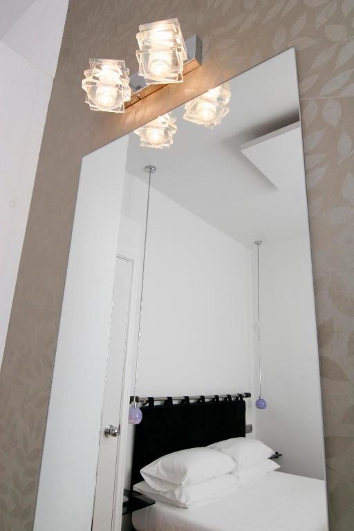 Postel nebo postele na pokoji v ubytování Hostal Santo Domingo
