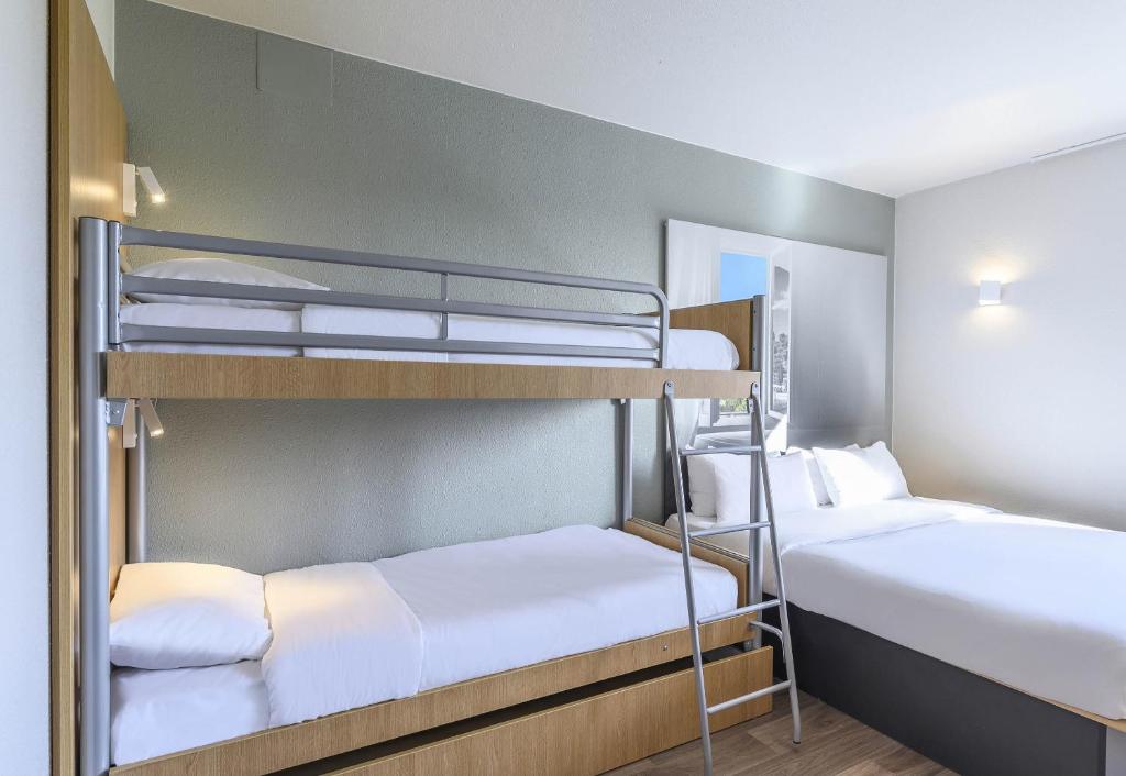 Postel nebo postele na pokoji v ubytování B&B HOTEL Orange