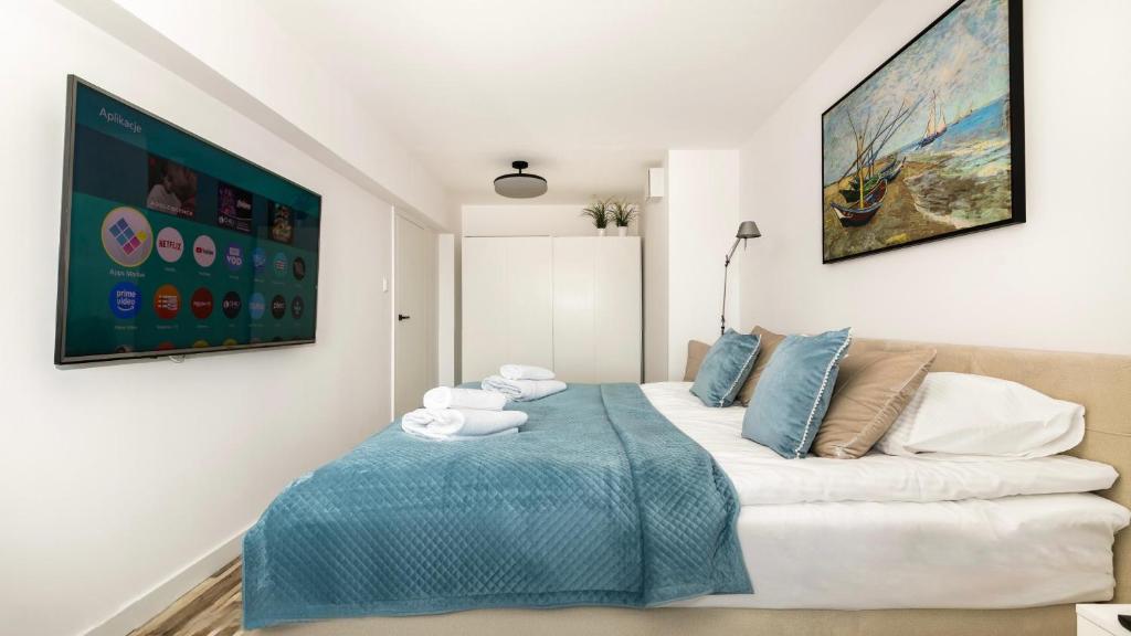 Postel nebo postele na pokoji v ubytování Comfy Apartments - Transatlantyk Lux
