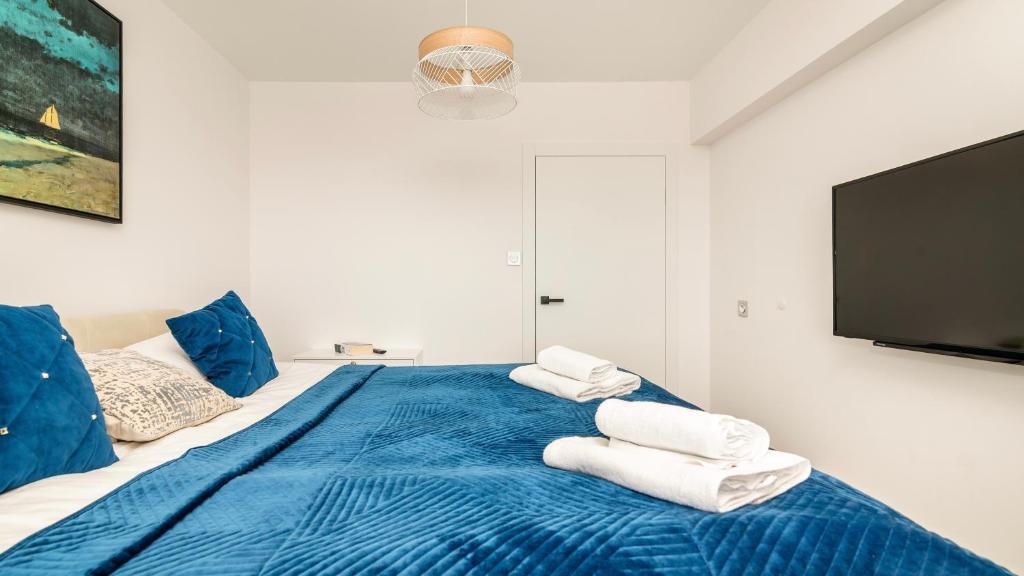 Postel nebo postele na pokoji v ubytování Comfy Apartments - Transatlantyk Lux