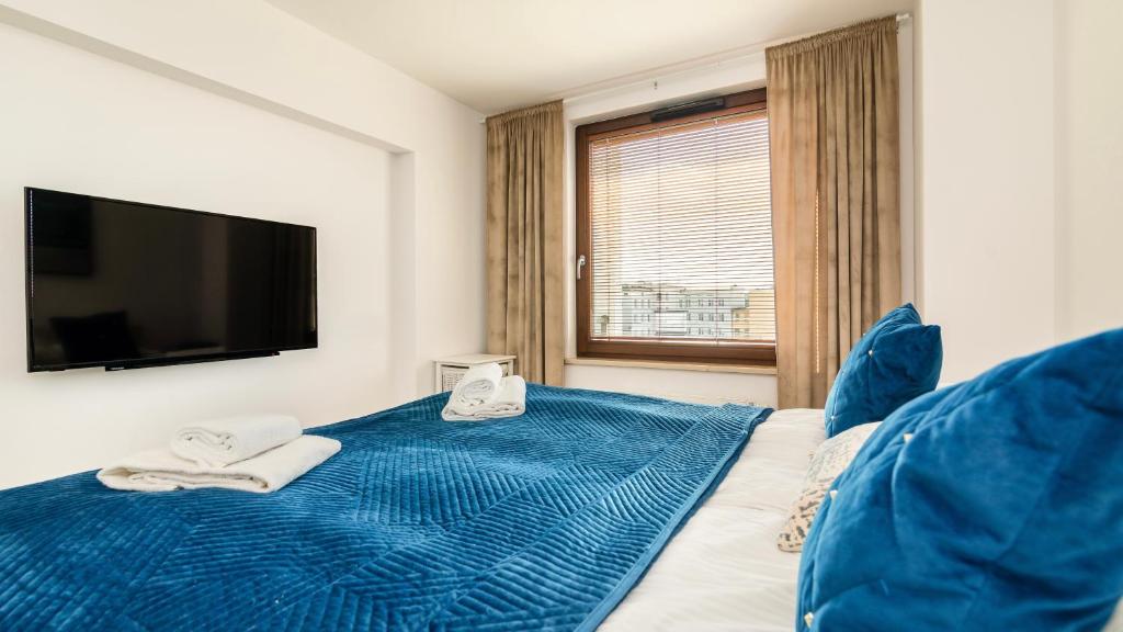 Postel nebo postele na pokoji v ubytování Comfy Apartments - Transatlantyk Lux