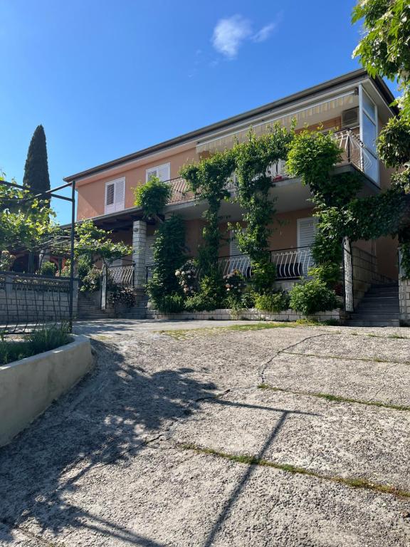 a building with a lot of plants on it at Apartments Furlan in Portorož