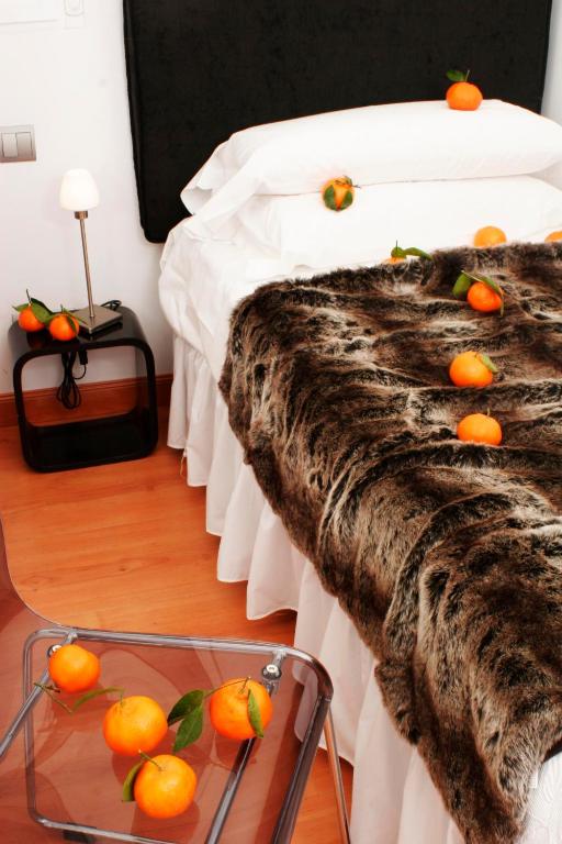 Postel nebo postele na pokoji v ubytování Hostal Santo Domingo