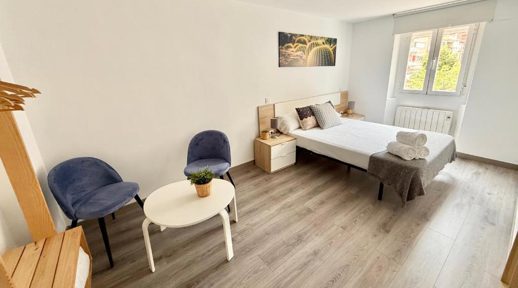 Postel nebo postele na pokoji v ubytování Apartamento Ramon Pignatelli