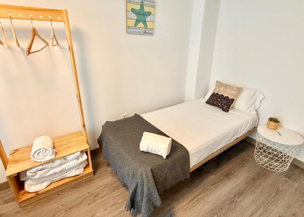 Postel nebo postele na pokoji v ubytování Apartamento Ramon Pignatelli