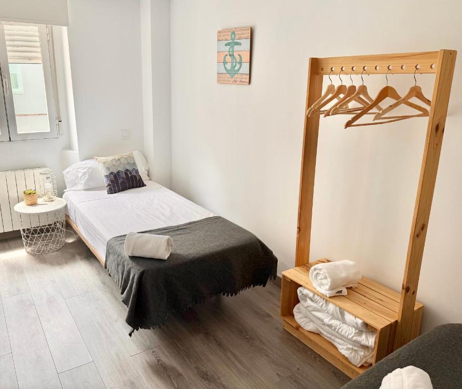 Postel nebo postele na pokoji v ubytování Apartamento Ramon Pignatelli