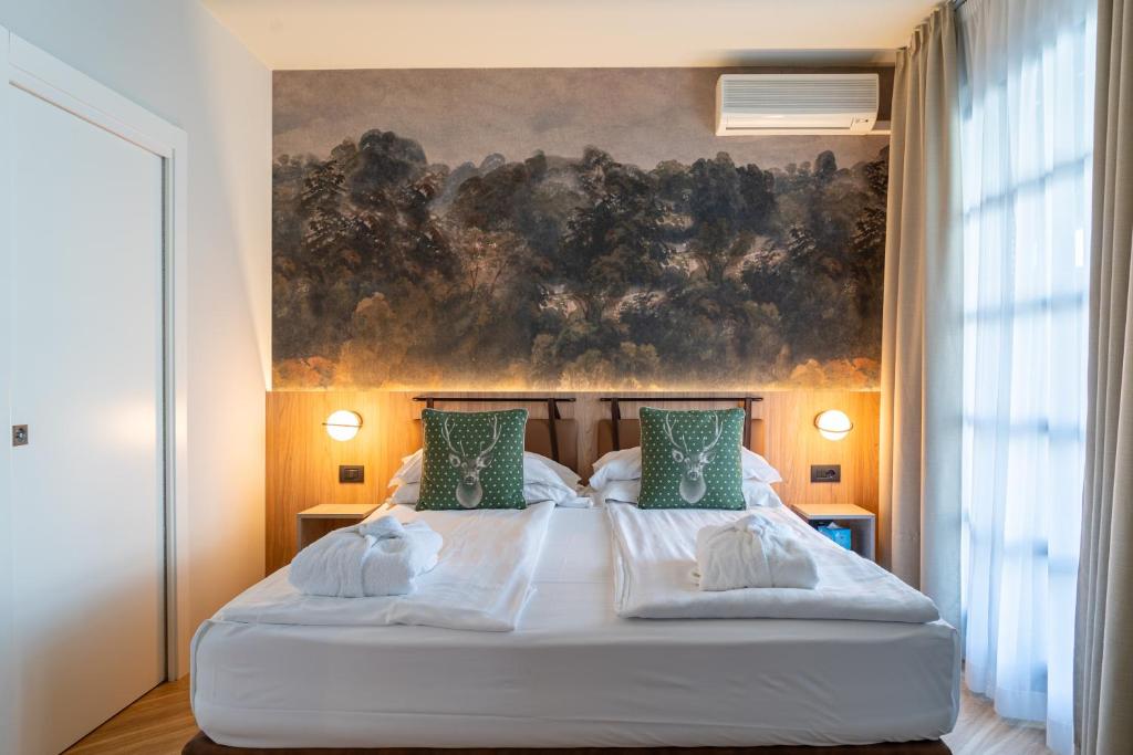 Postel nebo postele na pokoji v ubytování Hotel Querceto Wellness & Spa - Garda Lake Collection