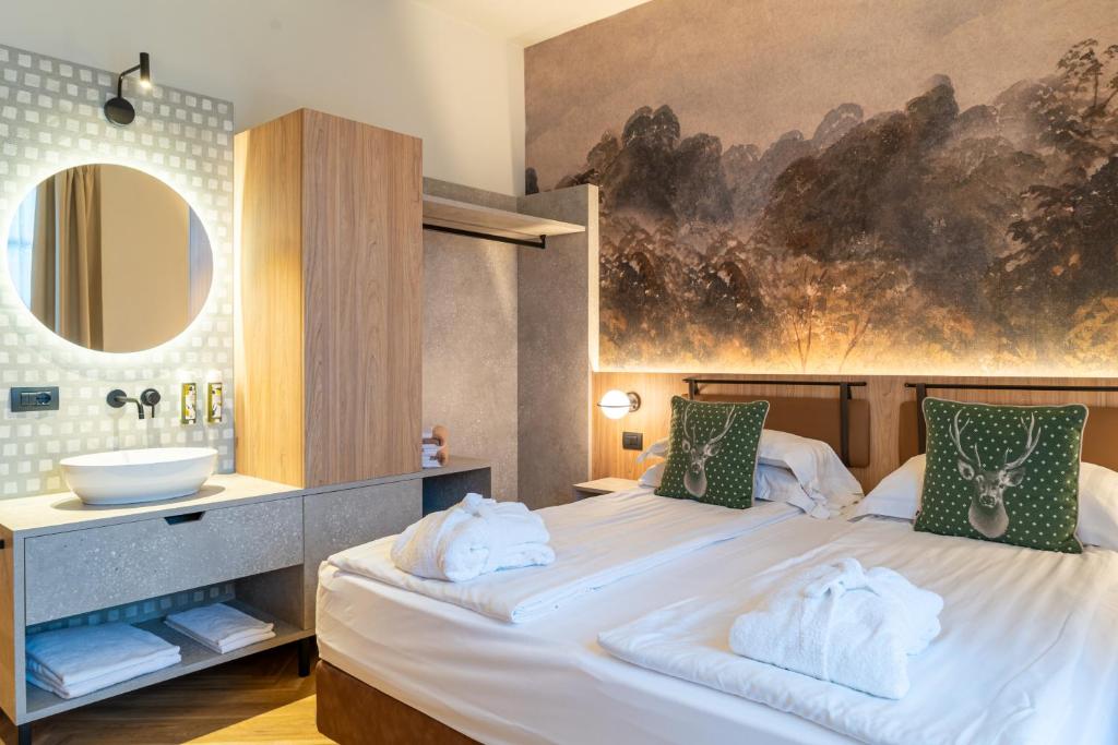 Postel nebo postele na pokoji v ubytování Hotel Querceto Wellness & Spa - Garda Lake Collection