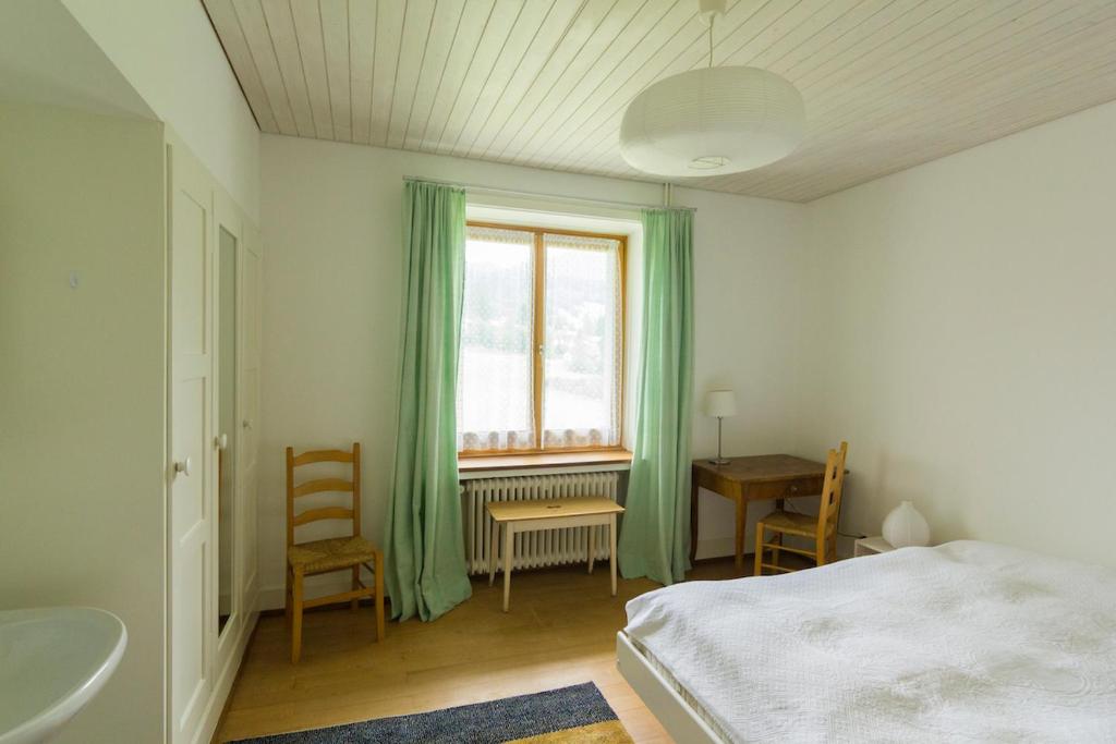 Postel nebo postele na pokoji v ubytování Edelweiss Haus Collina