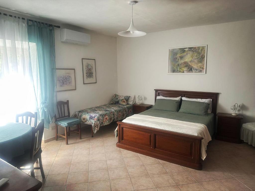 Ένα ή περισσότερα κρεβάτια σε δωμάτιο στο Il FONTANONE