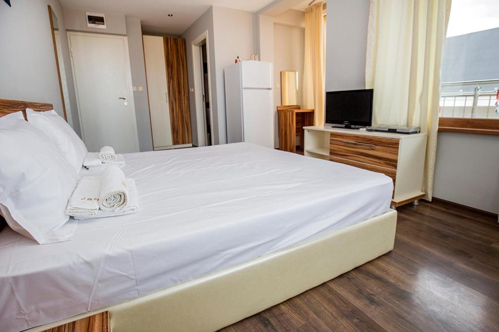 Postel nebo postele na pokoji v ubytování JBH Hotel
