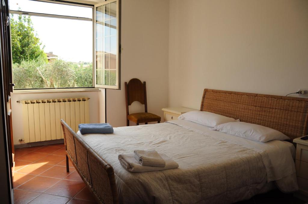 Ένα ή περισσότερα κρεβάτια σε δωμάτιο στο Casa di Cinzia