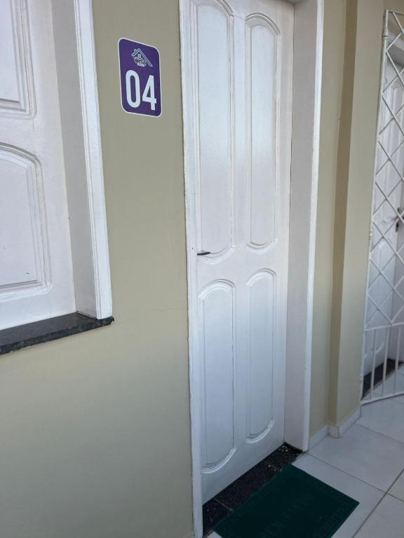 a room with a door with a sign on it at Orla Flats - Apartamento 04 in Bragança