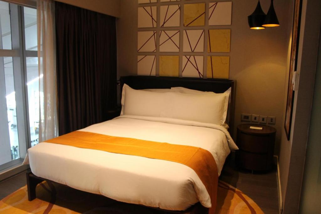 Postel nebo postele na pokoji v ubytování Hotel Grand Marina