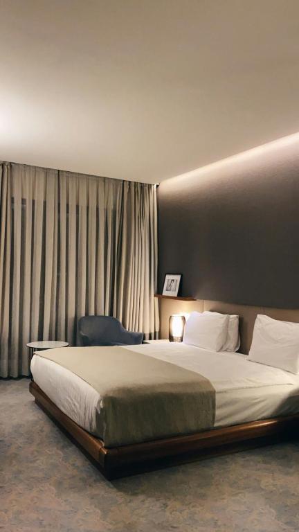 Postel nebo postele na pokoji v ubytování Hotel Grand Marina
