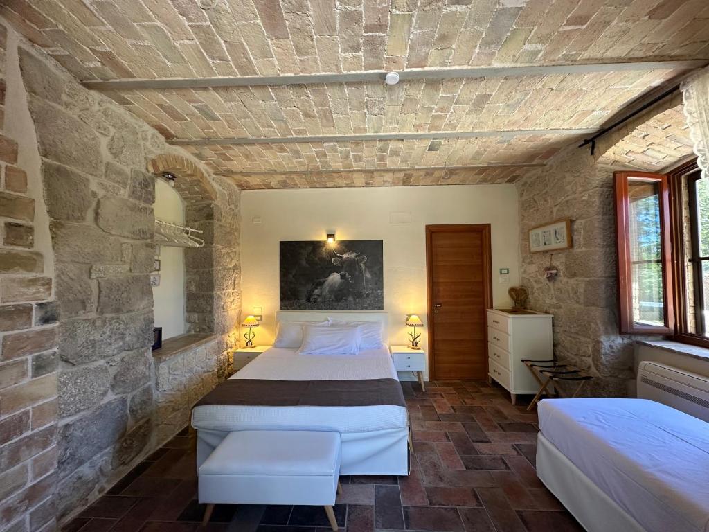 Postel nebo postele na pokoji v ubytování La quercia B&B