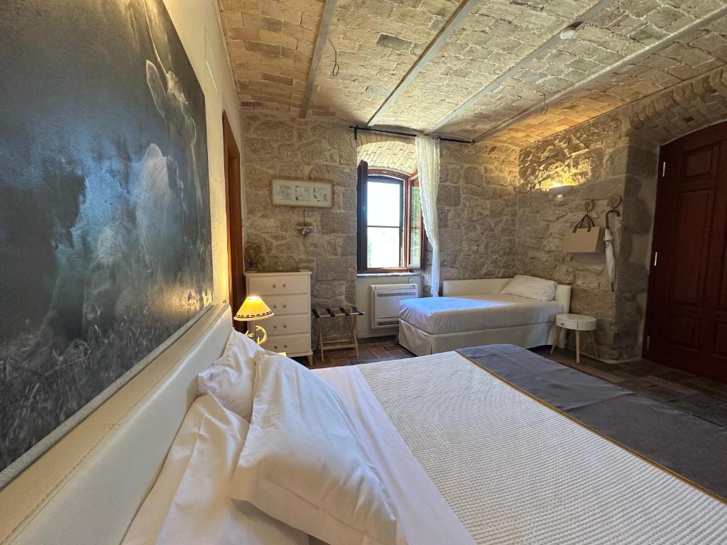 Postel nebo postele na pokoji v ubytování La quercia B&B